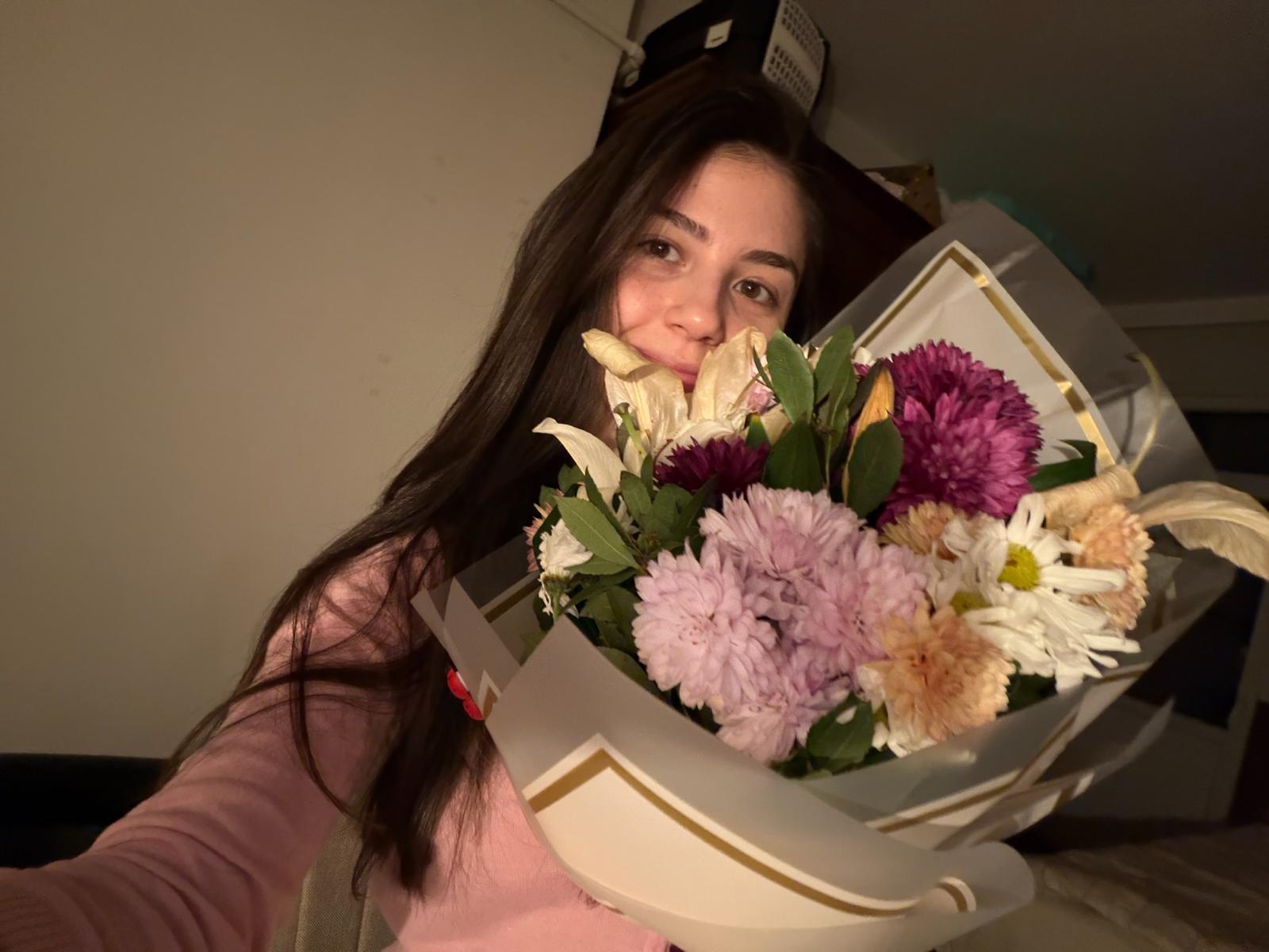 Hiding behind flowers but still outshining them